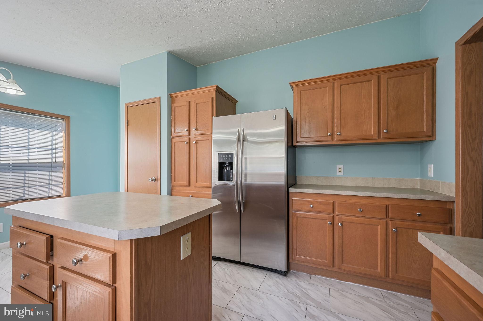 3992 Midstate Road Felton, DE 19943 - Photo 10 of 21 a kitchen with stainless steel appliances granite countertop a refrigerator and a sink