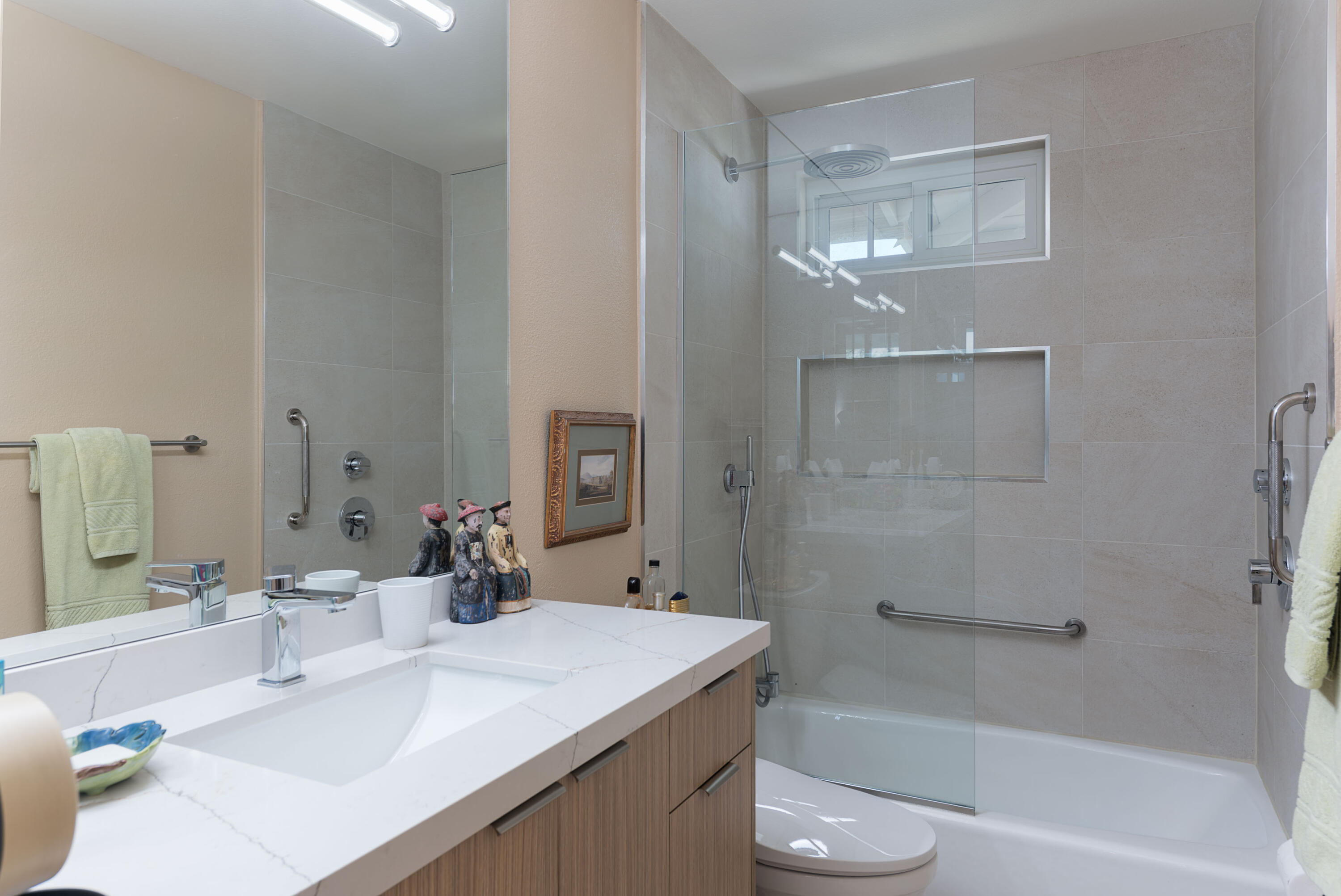 37116 Palmdale Road Rancho Mirage, CA 92270 - Photo 23 of 41 a bathroom with a sink a toilet and shower