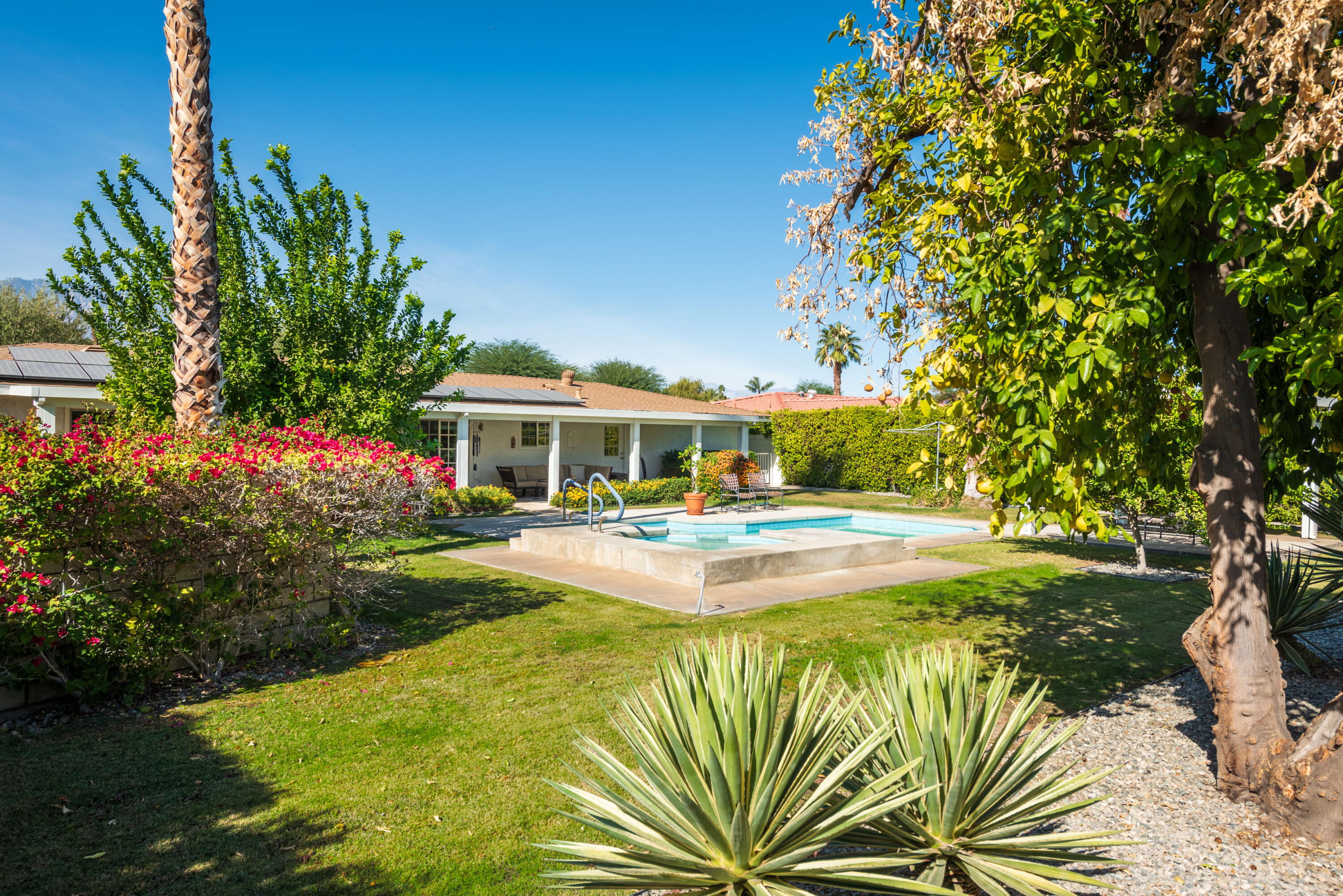 37116 Palmdale Road Rancho Mirage, CA 92270 - Photo 25 of 41 a view of swimming pool with garden
