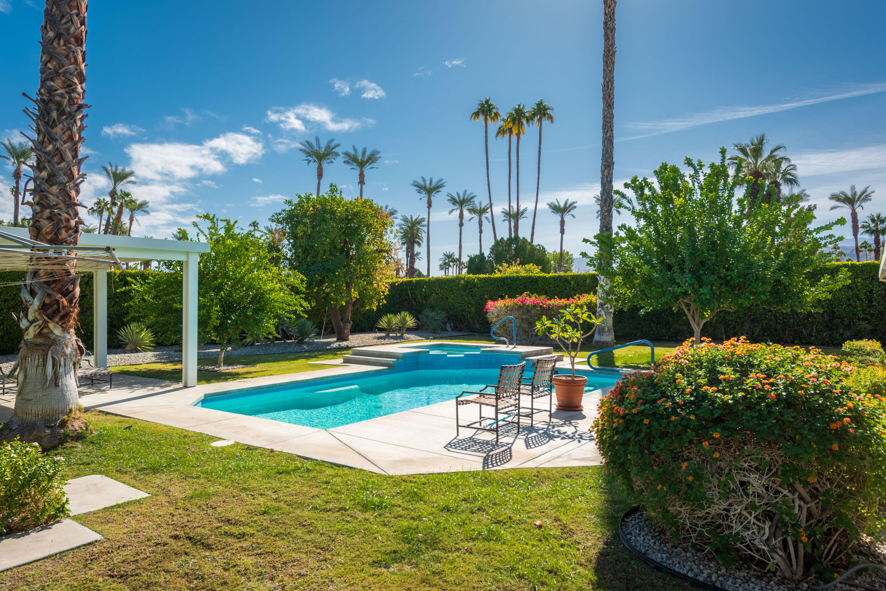 37116 Palmdale Road Rancho Mirage, CA 92270 - Photo 28 of 41 a swimming pool with outdoor seating and yard