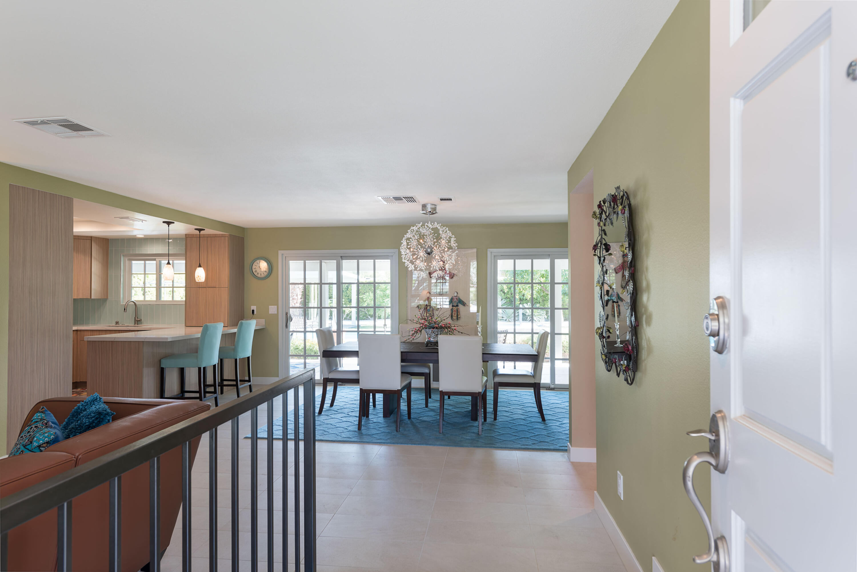 37116 Palmdale Road Rancho Mirage, CA 92270 - Photo 4 of 41 a view of a dining room and livingroom with furniture wooden floor a chandelier