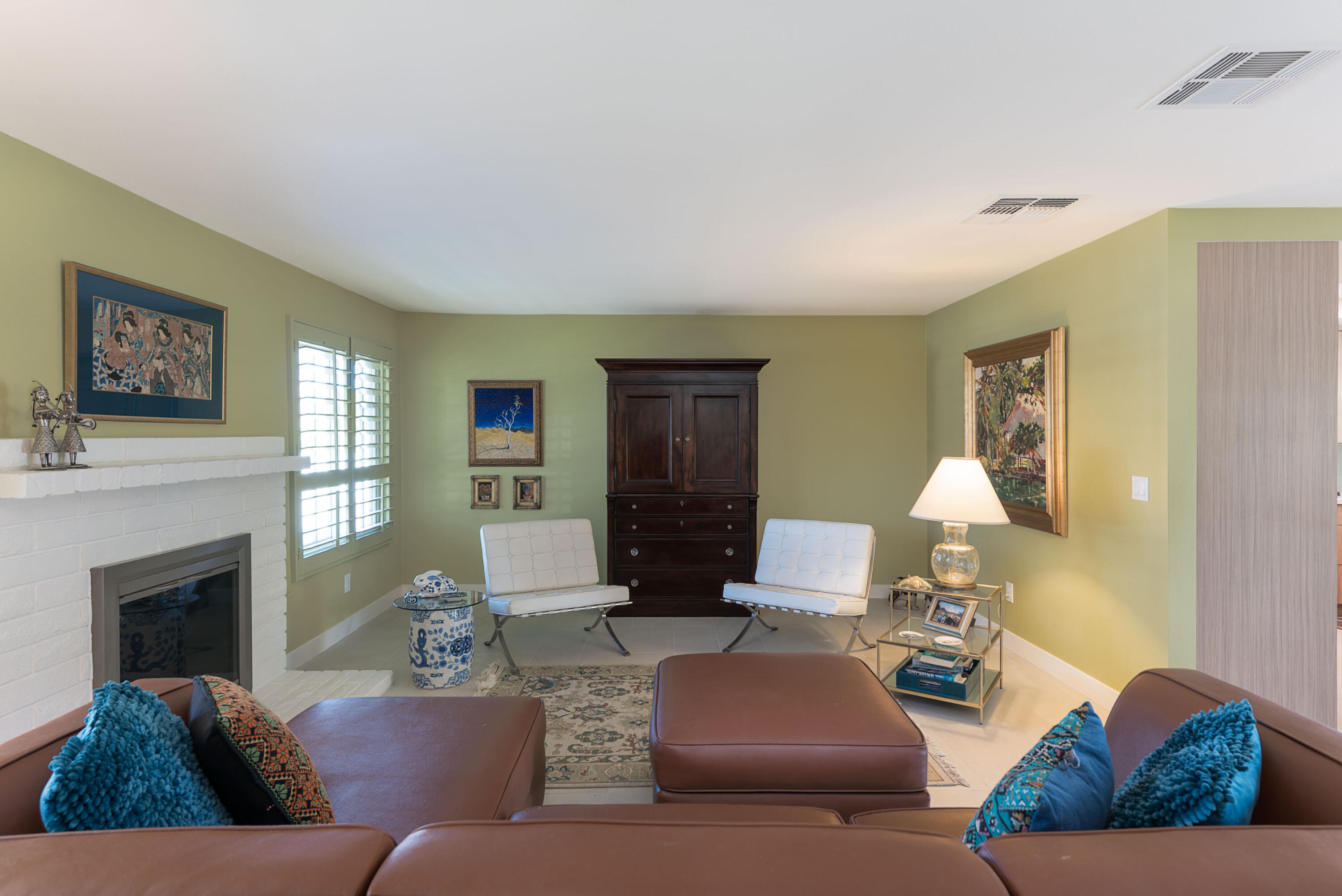 37116 Palmdale Road Rancho Mirage, CA 92270 - Photo 5 of 41 a living room with furniture and a fireplace