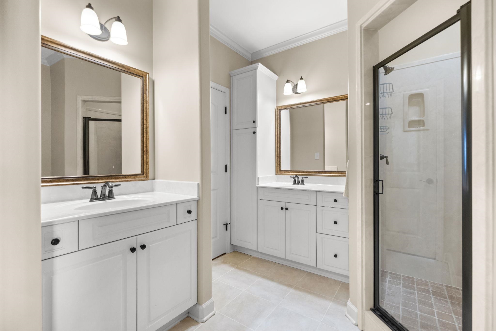 2275 McVay Road, Unit 2275 Germantown, TN 38138 - Photo 17 of 40 a bathroom with double vanity sinks and a mirror