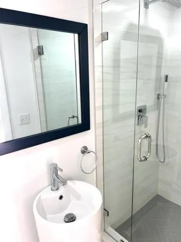 a bathroom with a sink and mirror