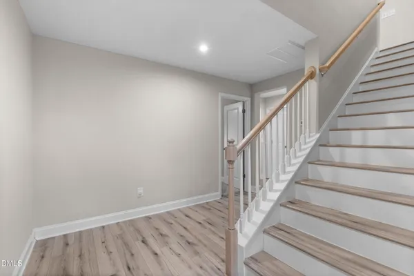a view of entryway with wooden floor