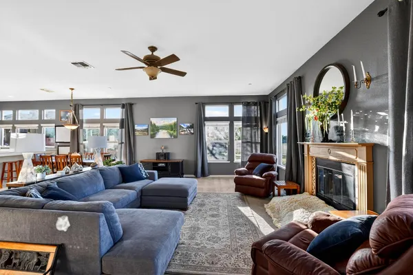 a dining room with furniture a livingroom and chandelier
