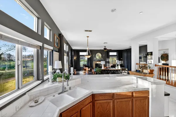 a bathroom with a sink vanity mirror and toilet