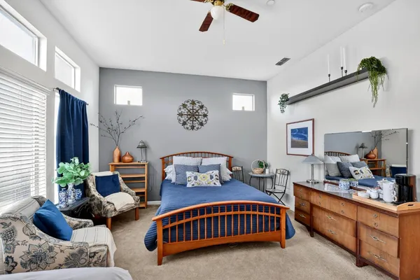 a bathroom with a sink double vanity granite and a large mirror