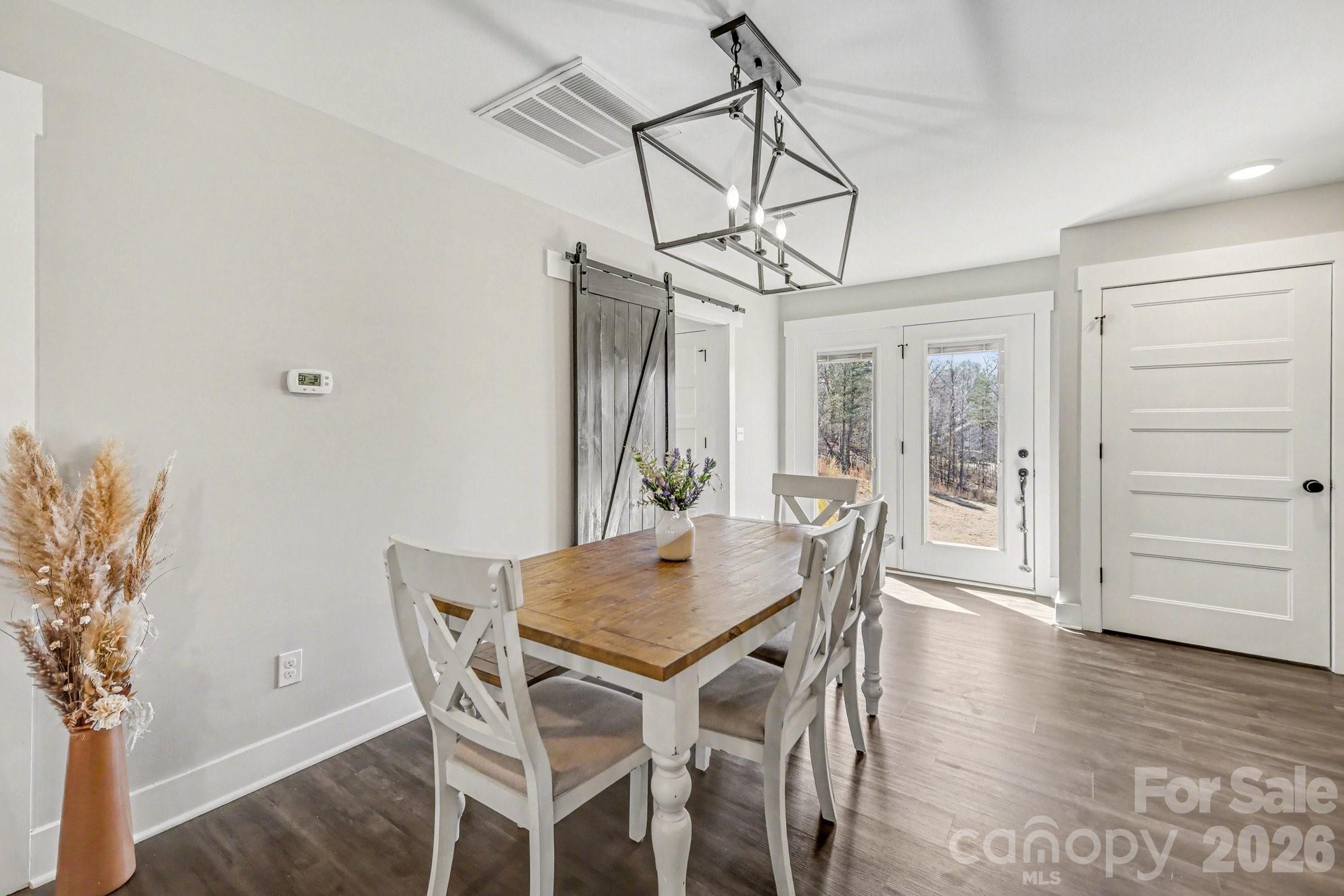 310 Old Hardin Road Dallas, NC 28034 - Photo 15 of 37 a view of a dining room with furniture window and wooden floor