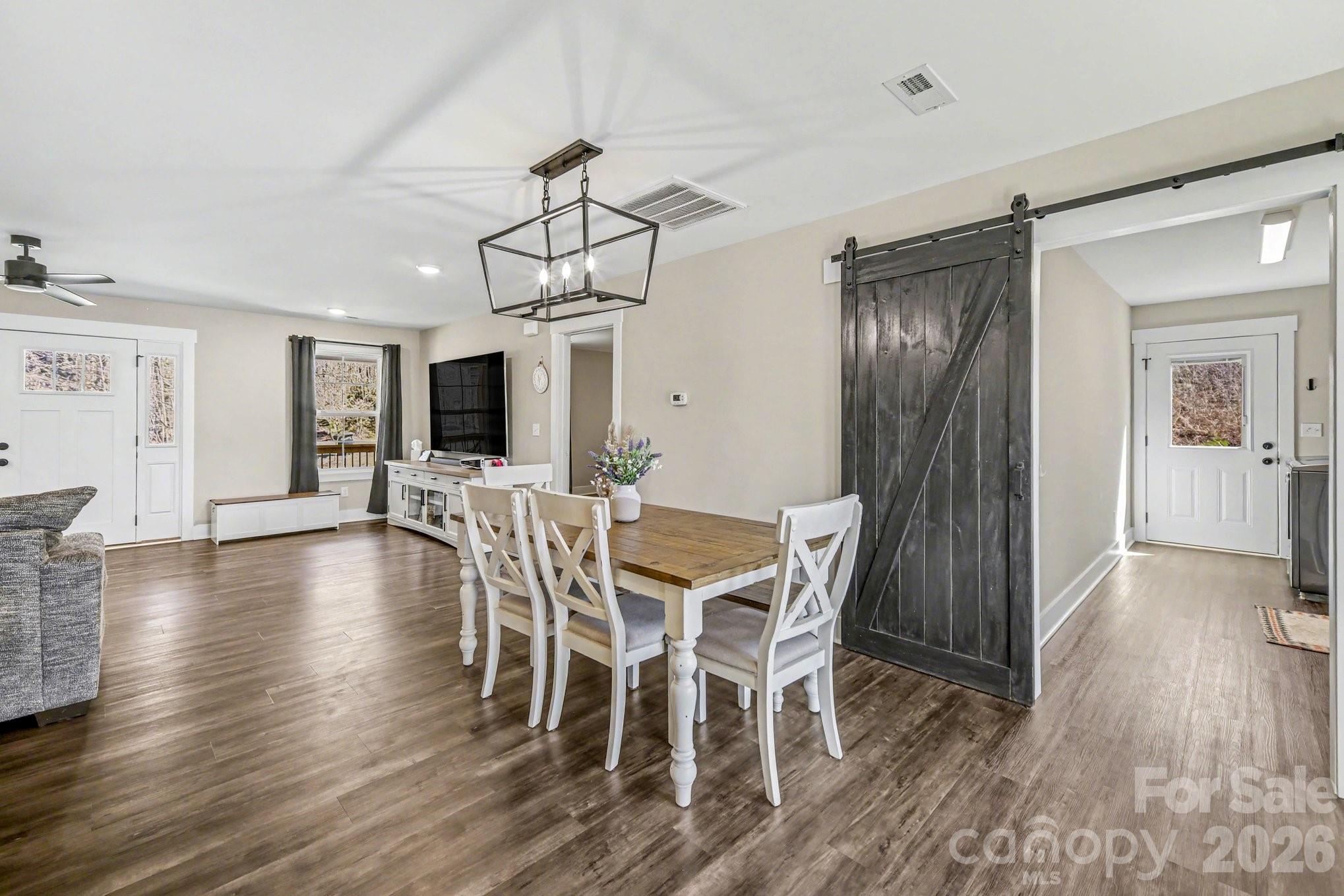 310 Old Hardin Road Dallas, NC 28034 - Photo 17 of 37 a view of a dining room with furniture and wooden floor