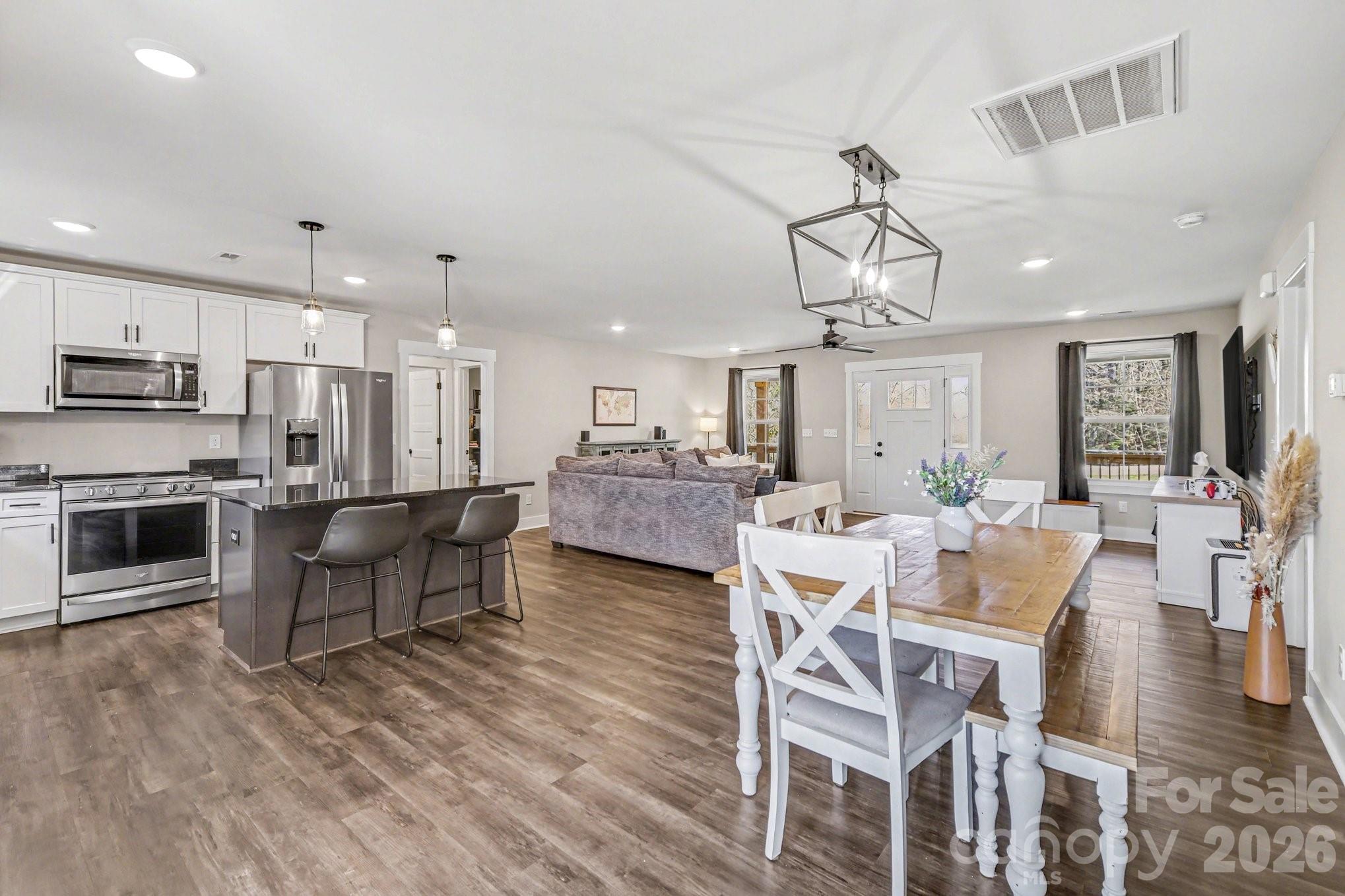 310 Old Hardin Road Dallas, NC 28034 - Photo 18 of 37 a large kitchen with a table and chairs