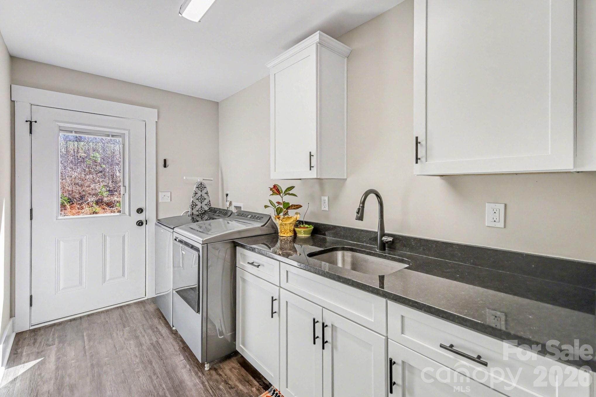 310 Old Hardin Road Dallas, NC 28034 - Photo 20 of 37 a kitchen with stainless steel appliances granite countertop white cabinets a sink and dishwasher