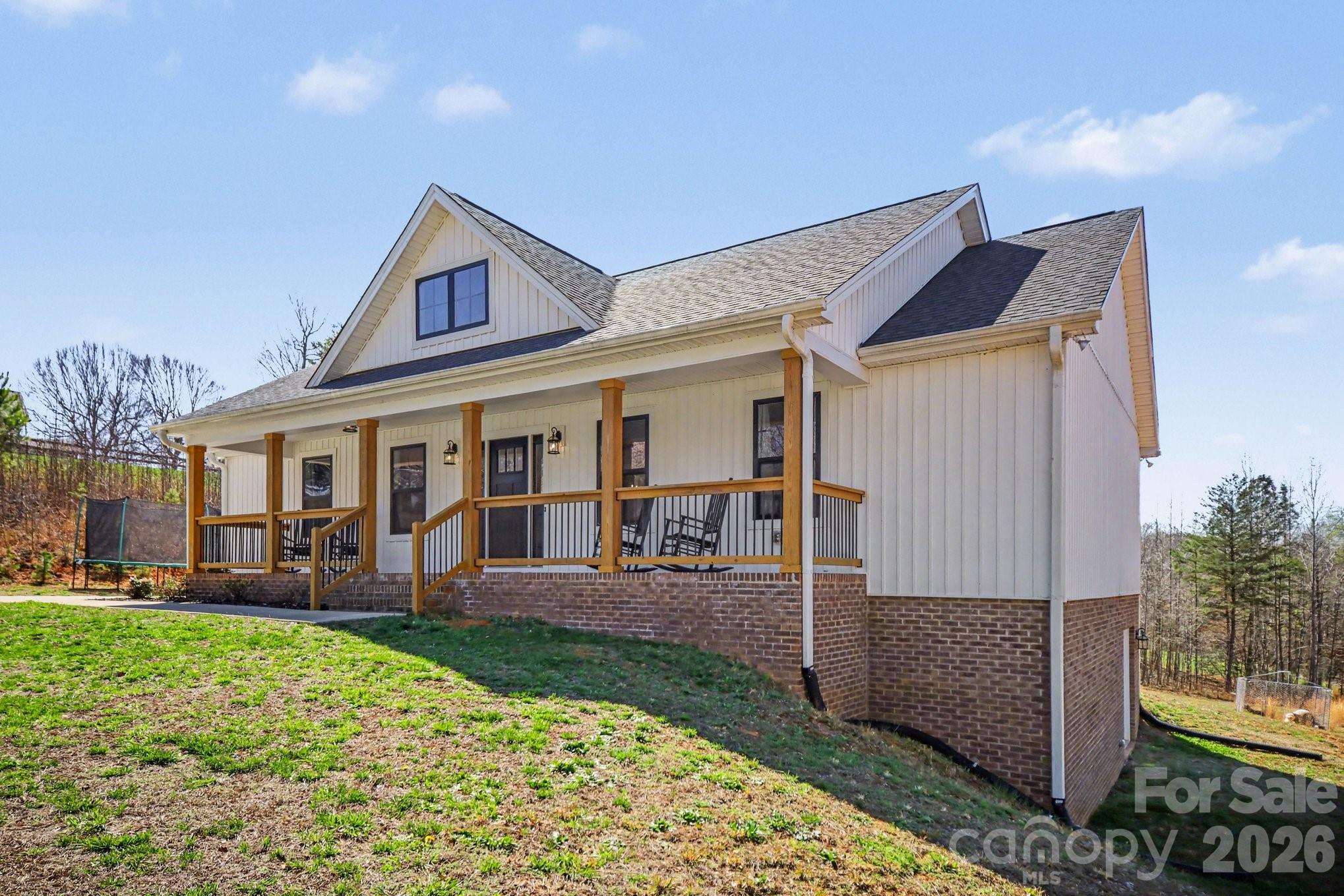 310 Old Hardin Road Dallas, NC 28034 - Photo 2 of 37 front view of a house with a yard