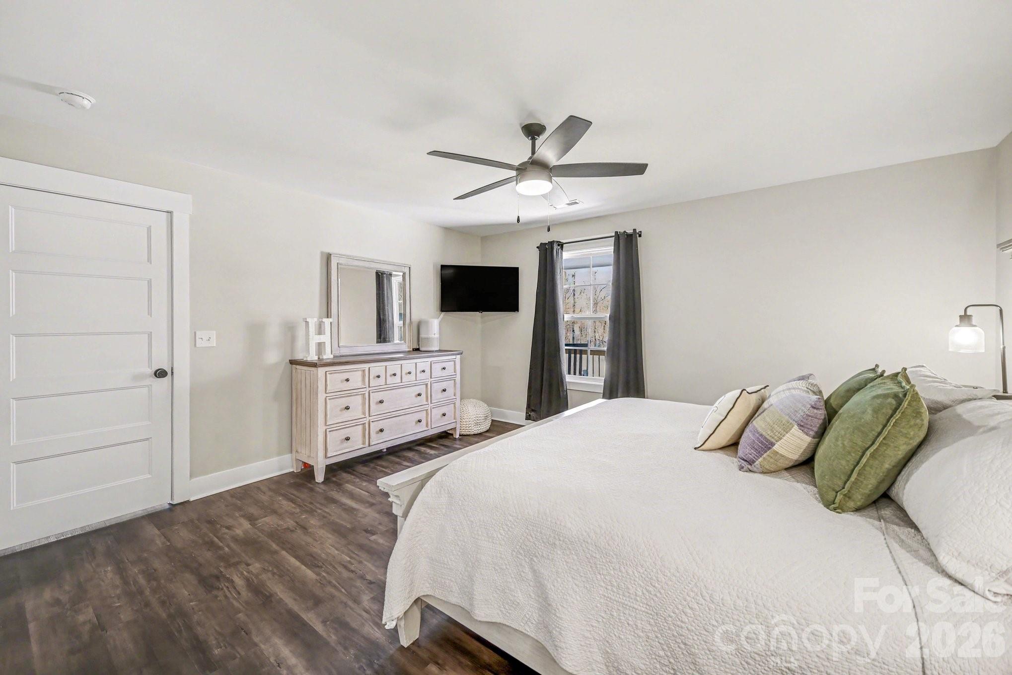 310 Old Hardin Road Dallas, NC 28034 - Photo 24 of 37 a bedroom with a bed and a tv