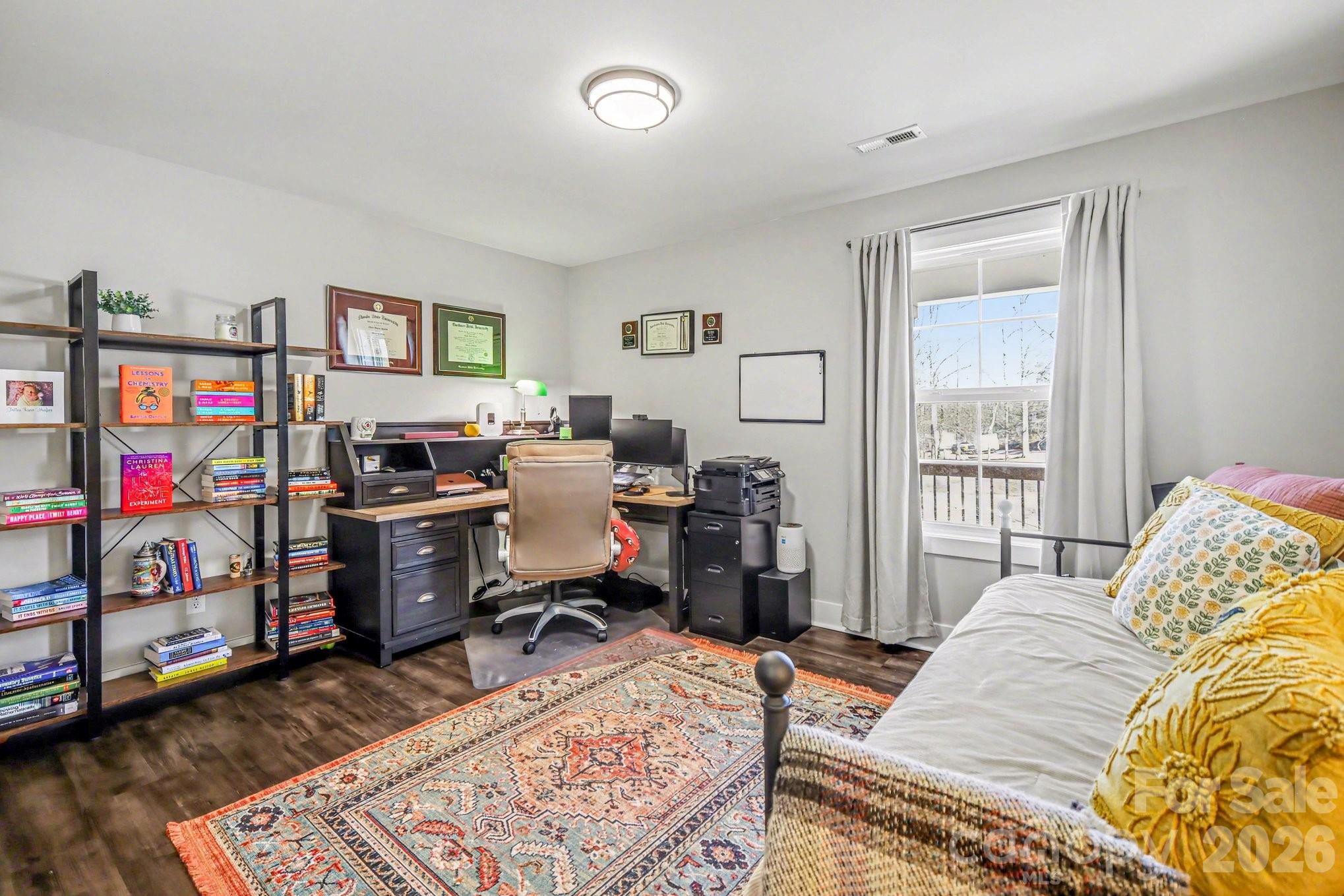 310 Old Hardin Road Dallas, NC 28034 - Photo 29 of 37 a bed room with a bed and a desk