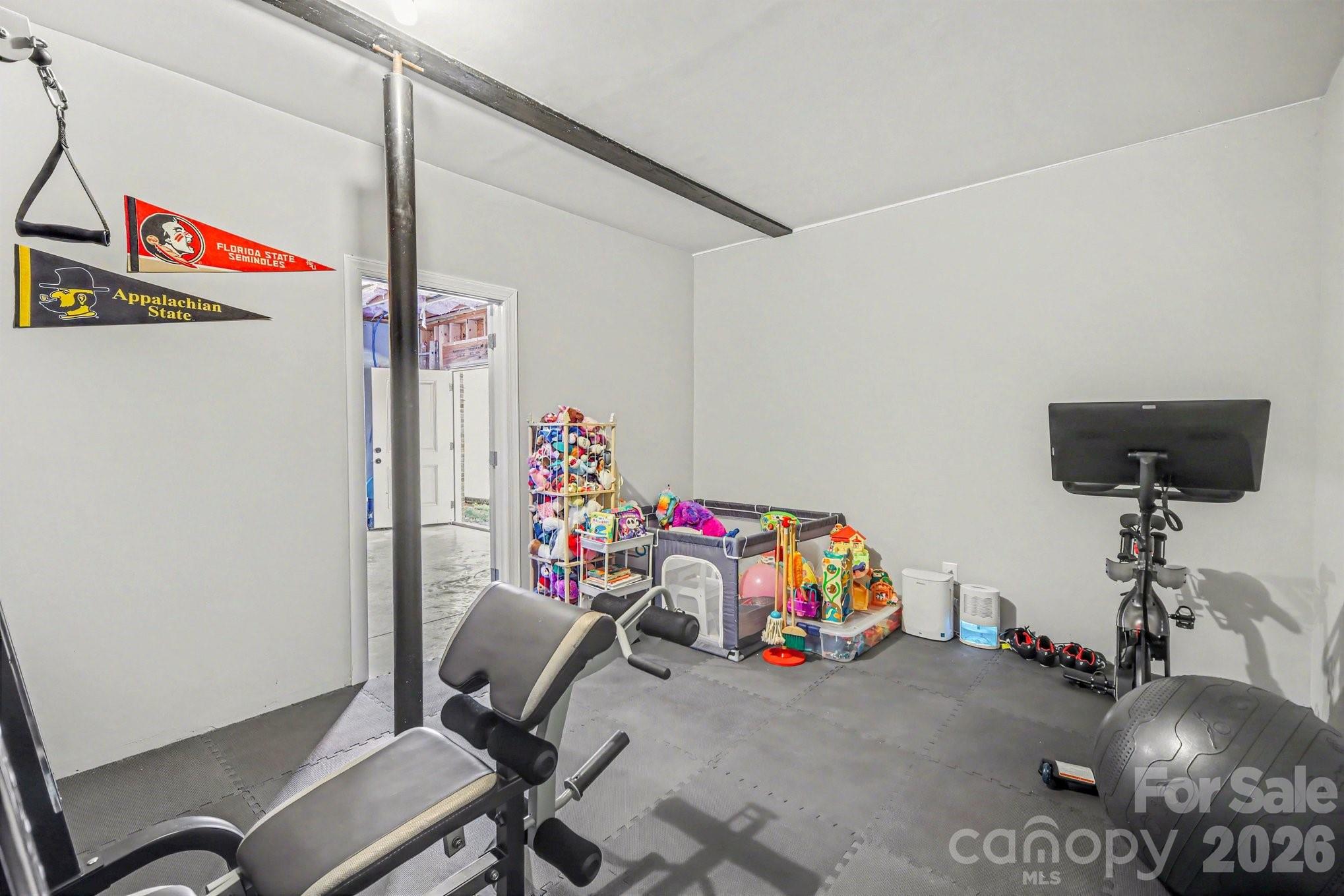 310 Old Hardin Road Dallas, NC 28034 - Photo 31 of 37 a bedroom with furniture and a lamp