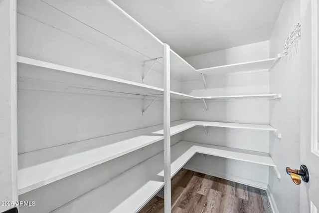 a kitchen with stainless steel appliances kitchen island granite countertop a stove and a sink