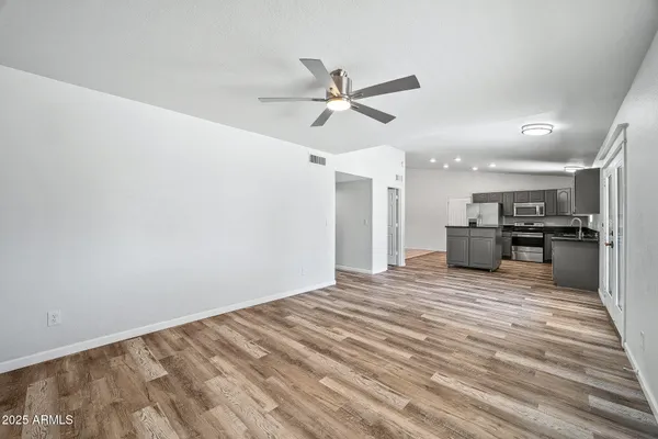 a view of walk in closet with empty racks