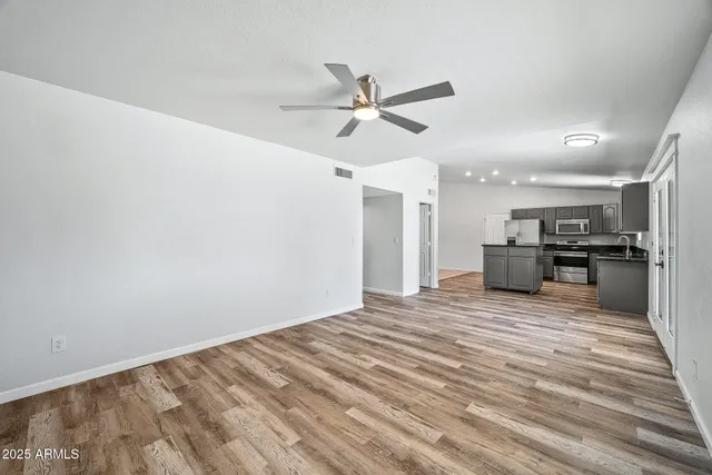 a view of walk in closet with empty racks