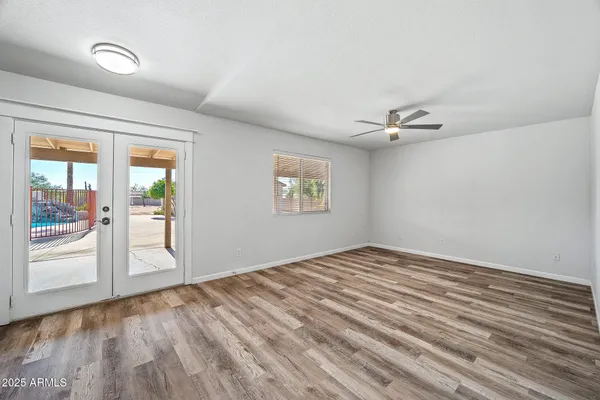 a view of a kitchen with a sink and a refrigerator