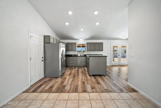 a view of empty room with a fireplace