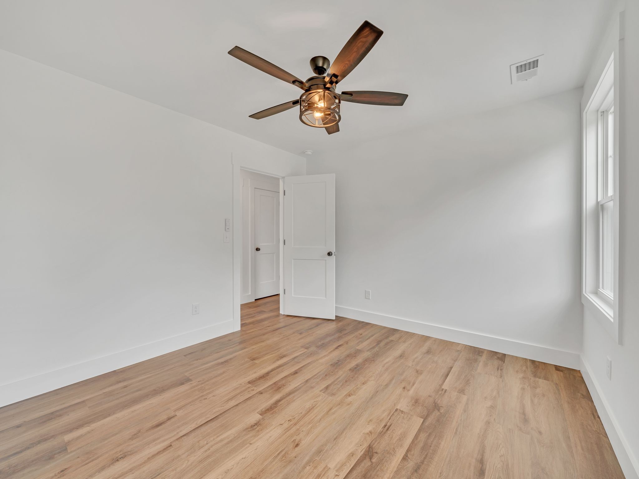 5800 Sanders Road Lyles, TN 37098 - Photo 18 of 28 wooden floor in an empty room with a window