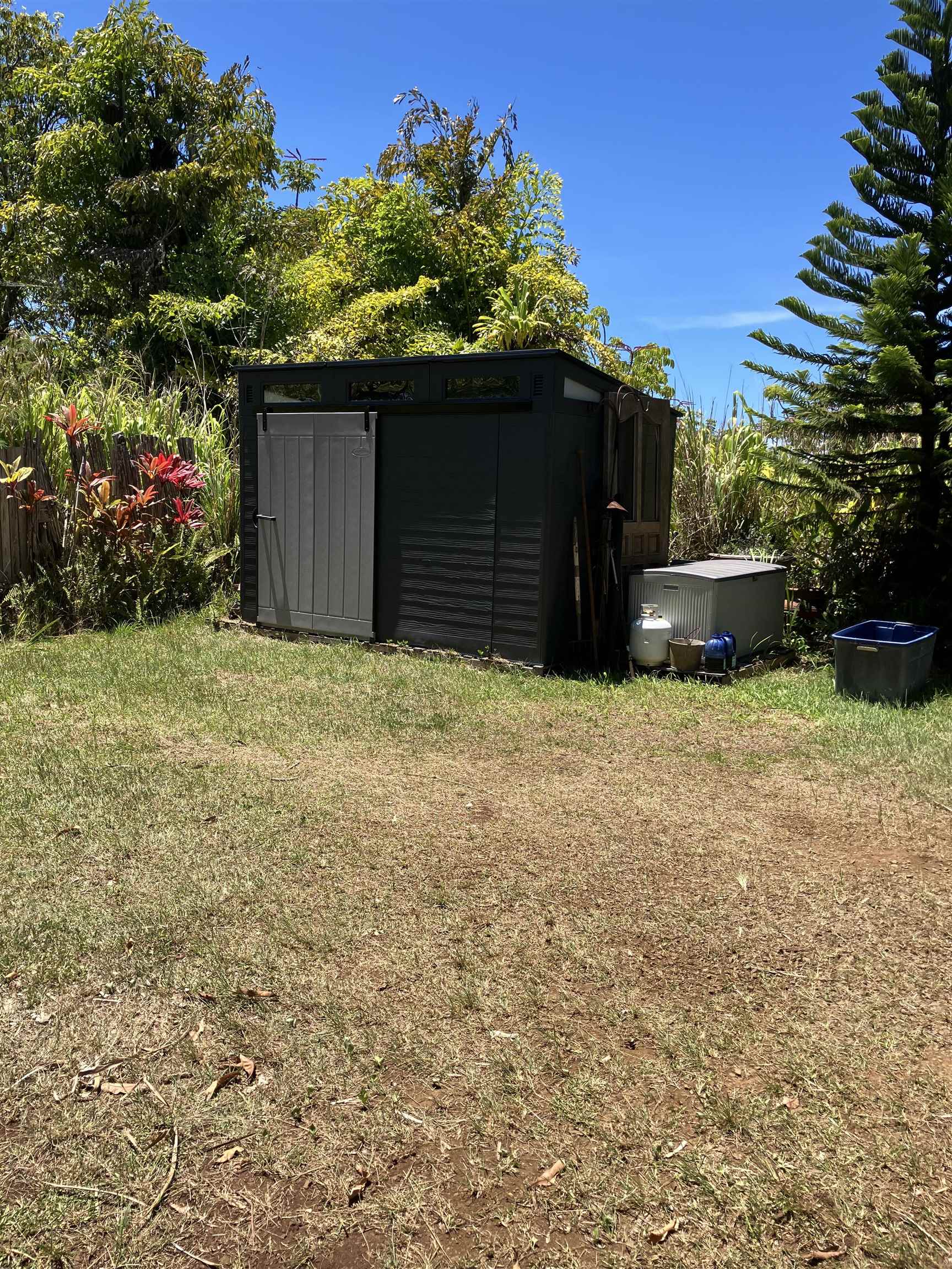 0 North Holokai Road Haiku, HI 96708 - Photo 1 of 1 a view of a house with a yard and potted plants