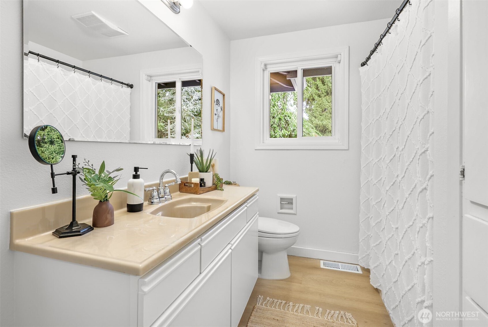24125 2nd Place West Bothell, WA 98021 - Photo 13 of 29 a bathroom with a sink a toilet and a window