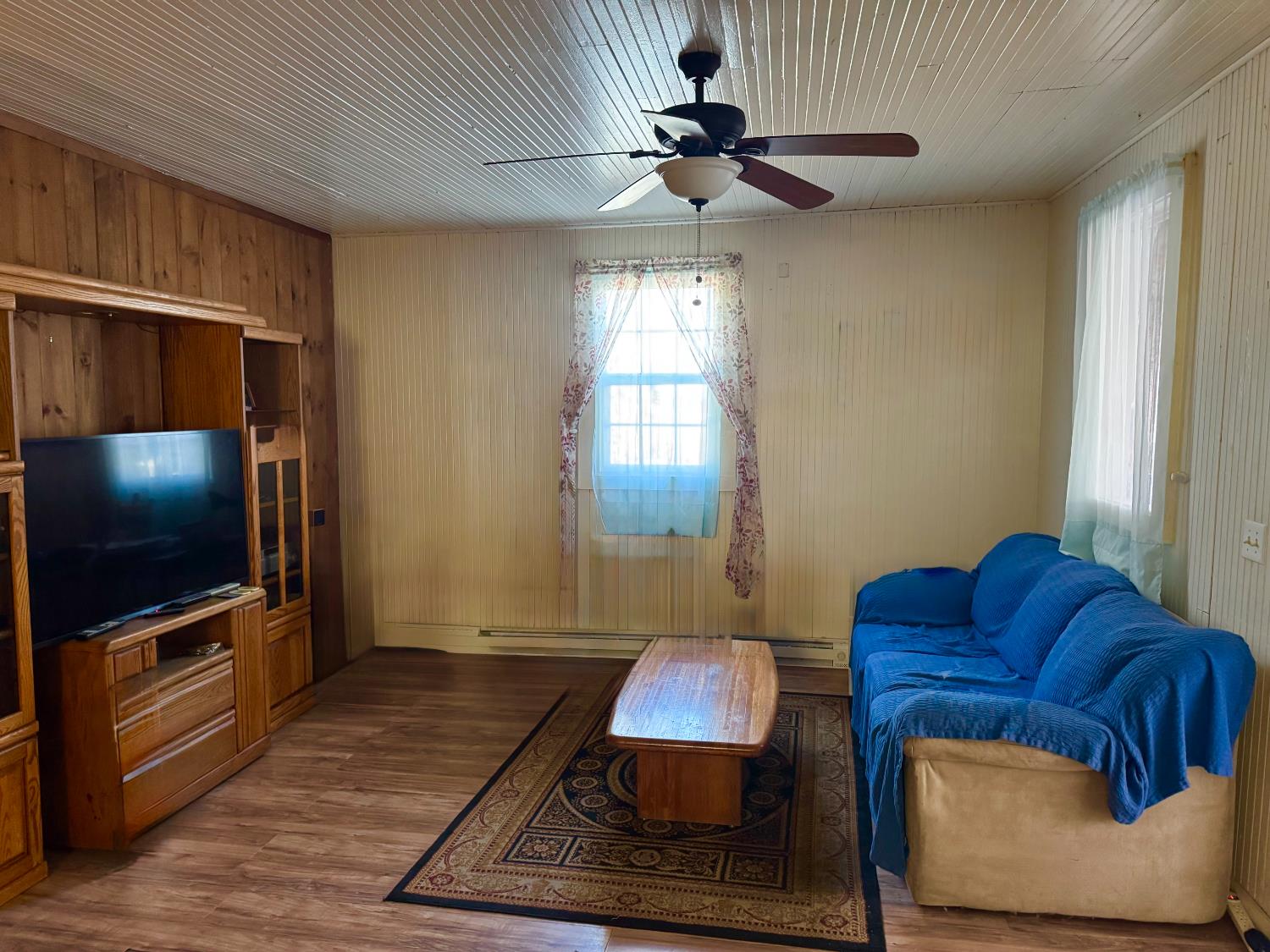 13911 River Road Walnut Grove, CA 95690 - Photo 4 of 9 a living room with furniture and a flat screen tv
