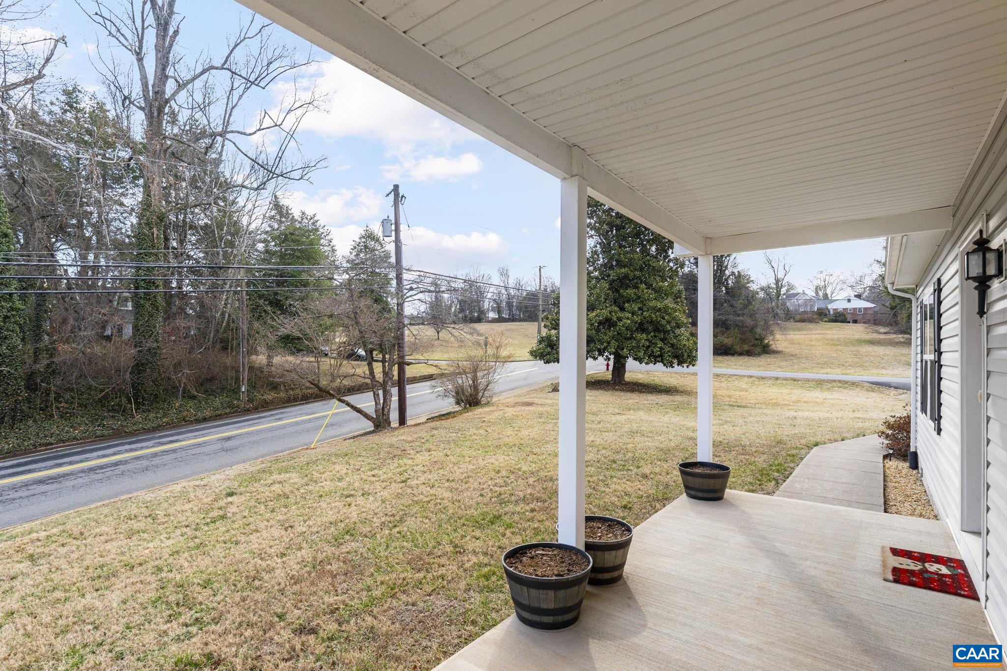 133 Red Hill Road Orange, VA 22960 - Photo 11 of 38 a view of a balcony with table and chairs and wooden fence