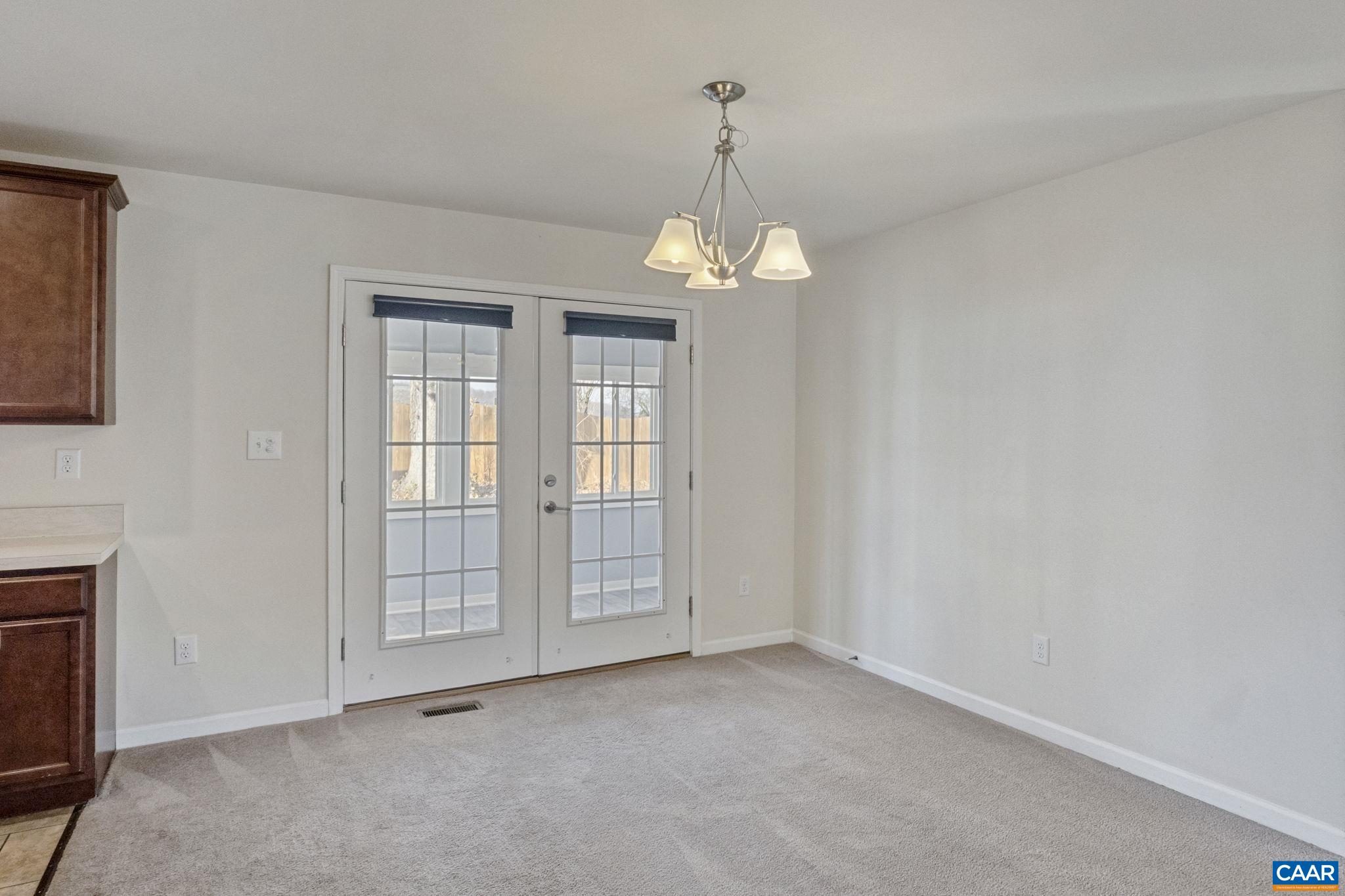 133 Red Hill Road Orange, VA 22960 - Photo 20 of 38 an empty room with chandelier fan and windows