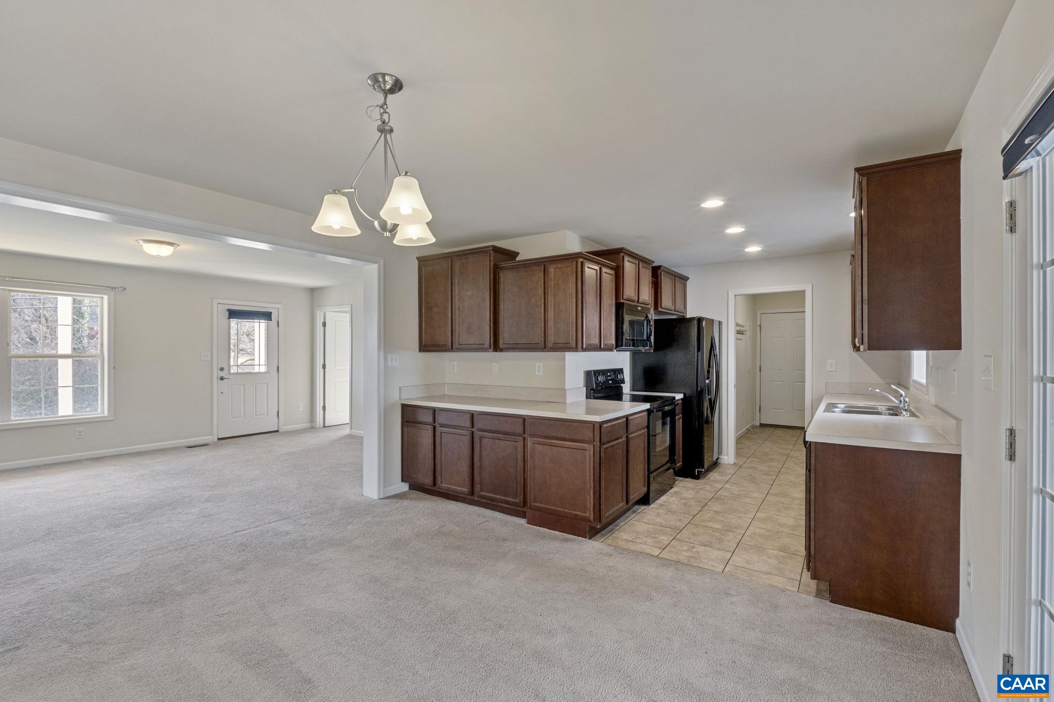133 Red Hill Road Orange, VA 22960 - Photo 21 of 38 a kitchen with cabinets a sink and stainless steel appliances
