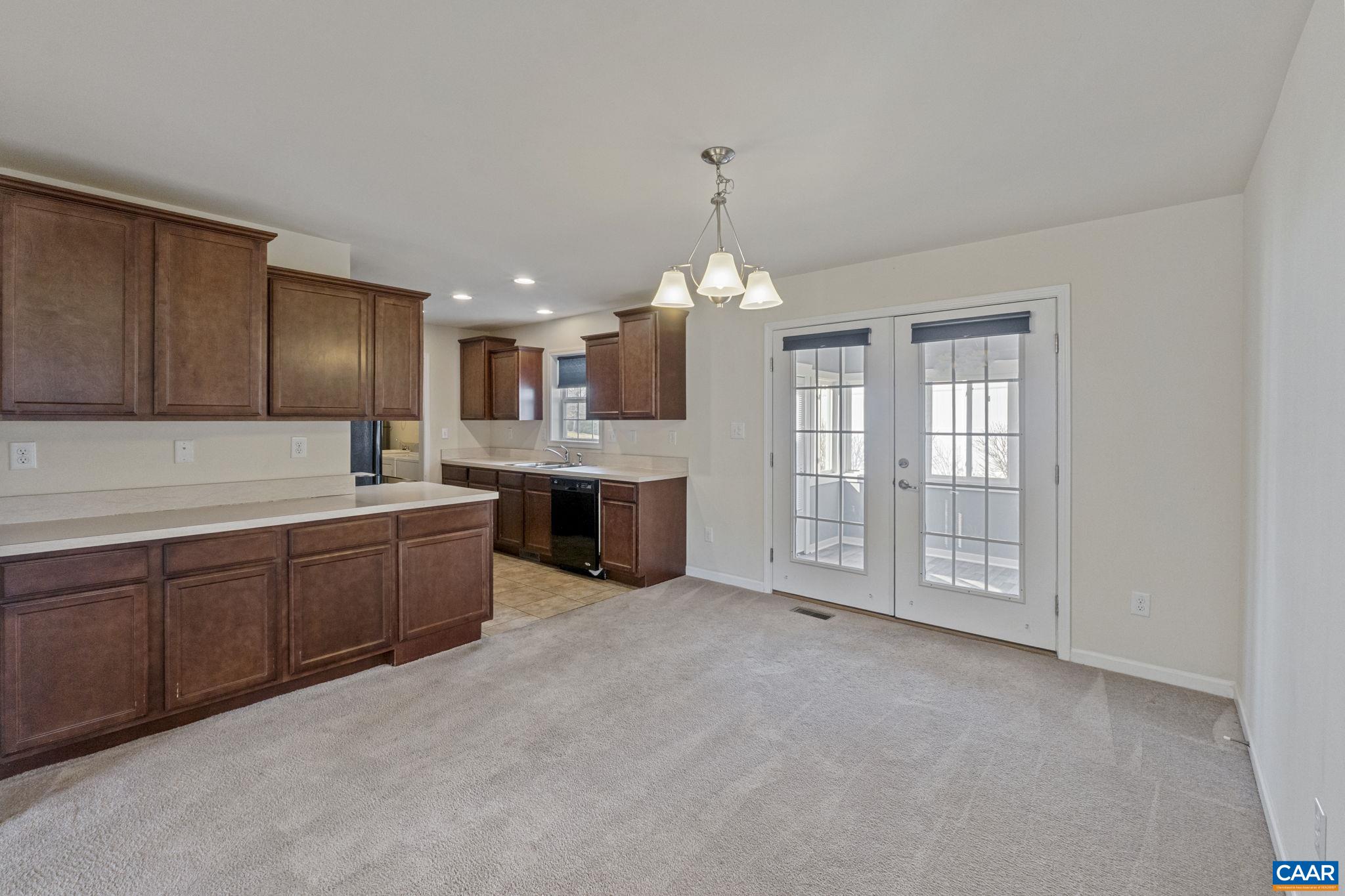 133 Red Hill Road Orange, VA 22960 - Photo 22 of 38 a large kitchen with granite countertop a stove sink and cabinets