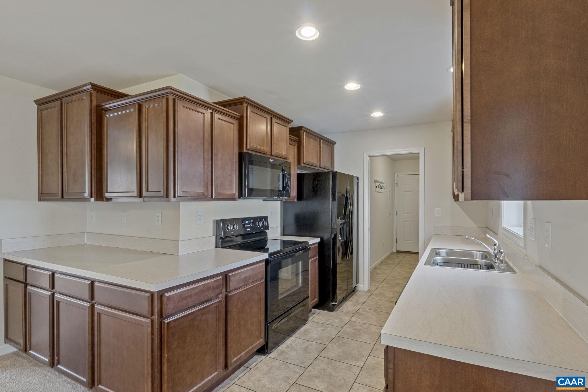 133 Red Hill Road Orange, VA 22960 - Photo 23 of 38 a kitchen with stainless steel appliances granite countertop a sink stove and refrigerator