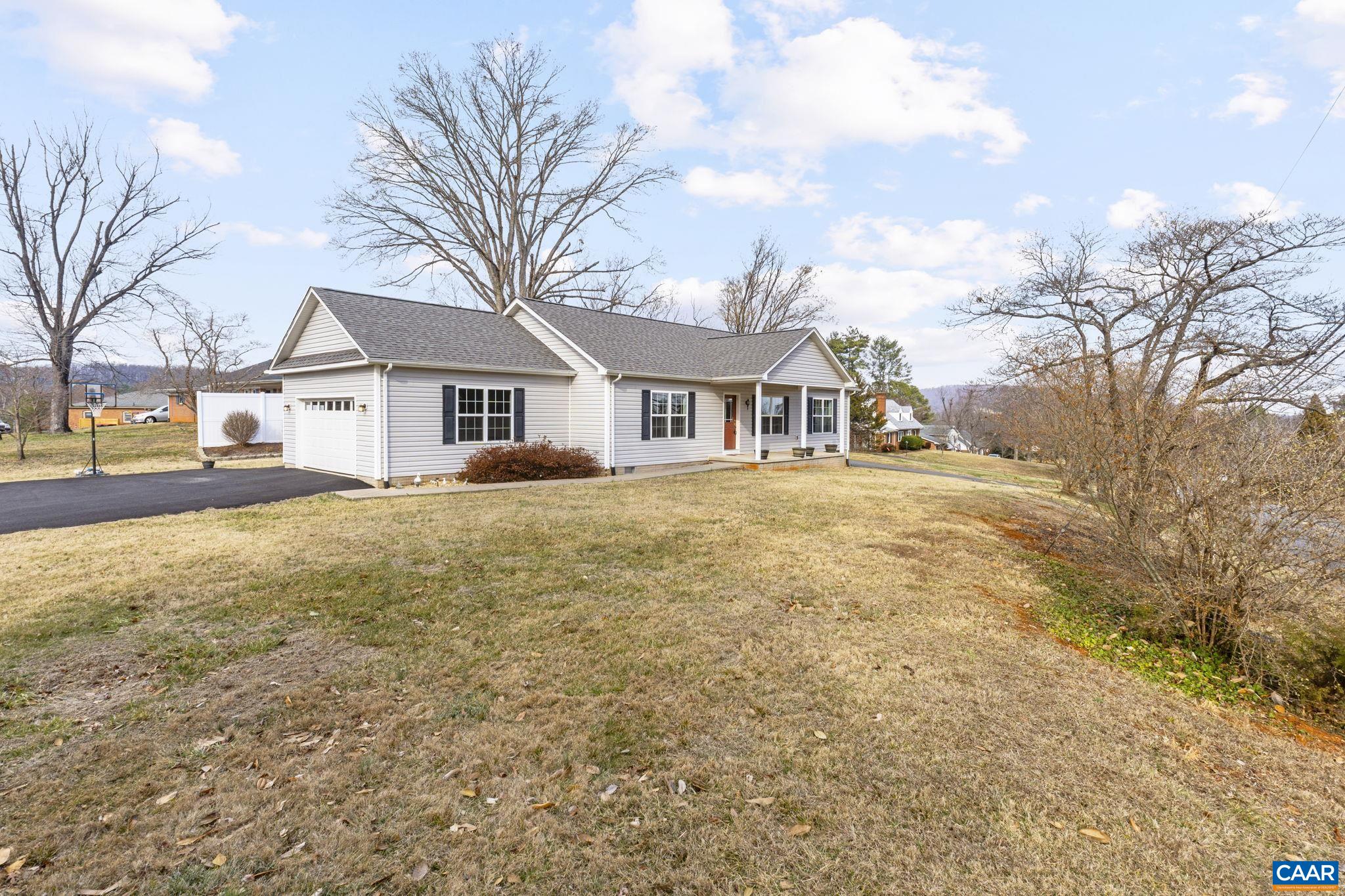 133 Red Hill Road Orange, VA 22960 - Photo 3 of 38 a front view of house with yard and trees around