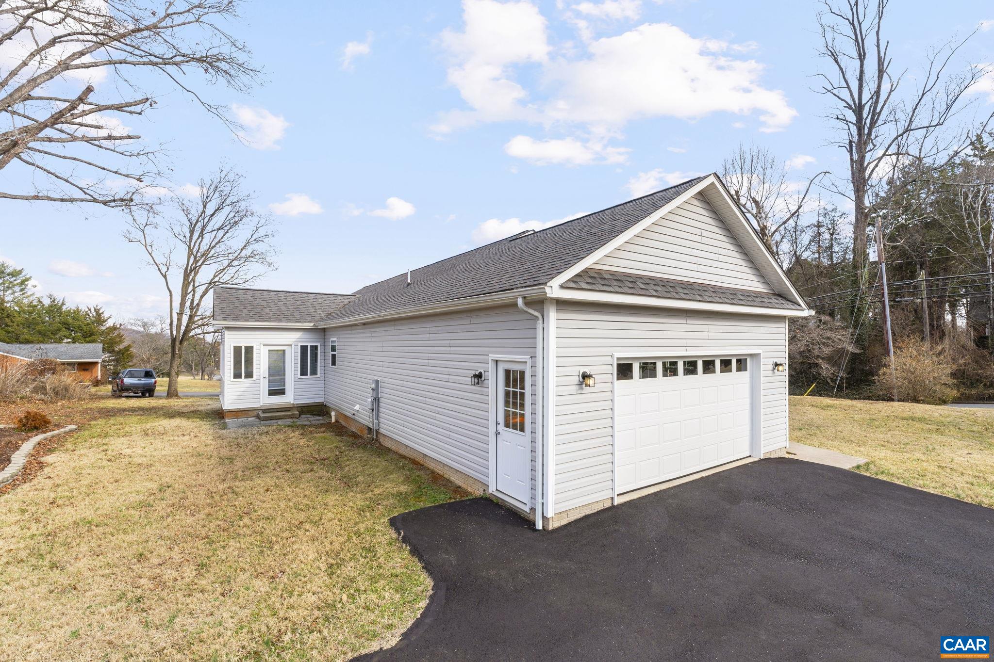 133 Red Hill Road Orange, VA 22960 - Photo 4 of 38 a view of a white house with a yard covered in snow
