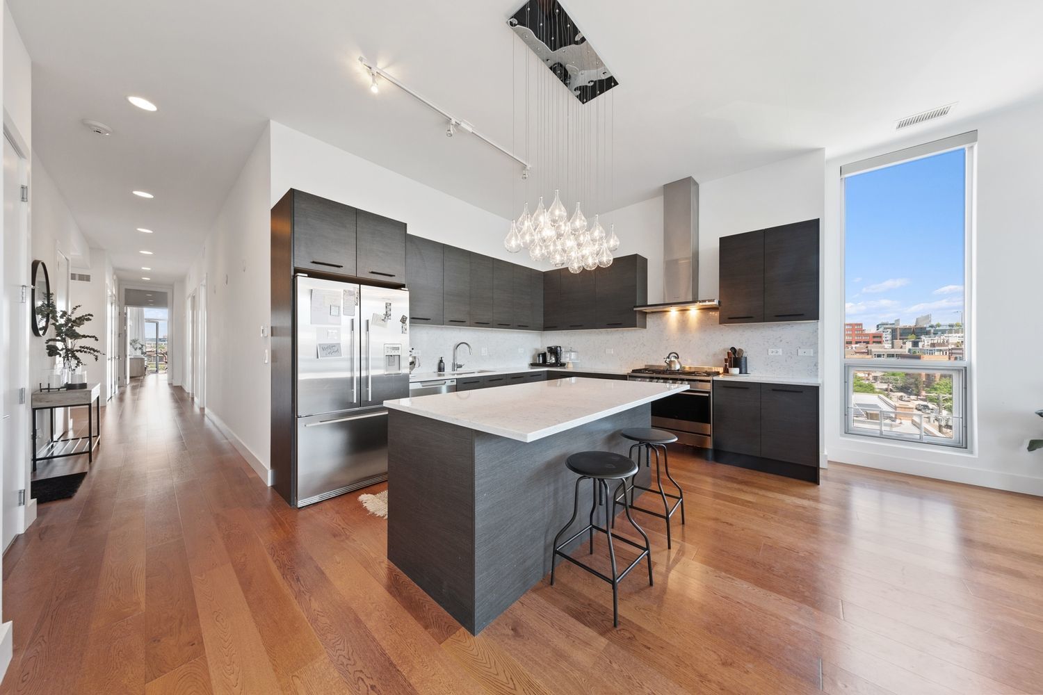 122 South Aberdeen Street, Unit 5N Chicago, IL 60607 - Photo 3 of 23 a view of kitchen with cabinets counter top space and stainless steel appliances