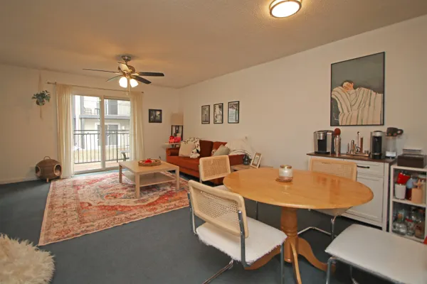 a very nice looking dining room with a table and chairs