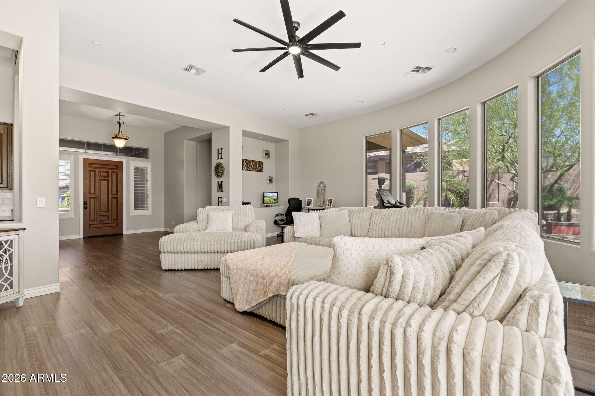 41619 North River Bend Road Anthem, AZ 85086 - Photo 13 of 84 a living room with couches and a large window