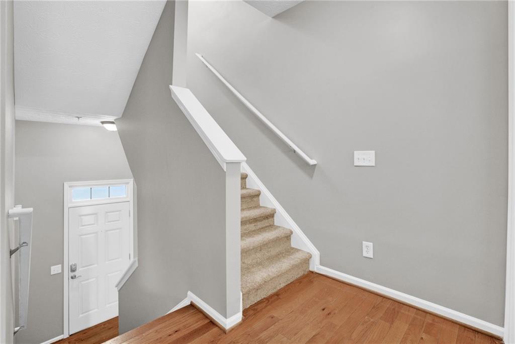 241 Village Square Drive Woodstock, GA 30188 - Photo 11 of 40 a view of entryway with wooden floor