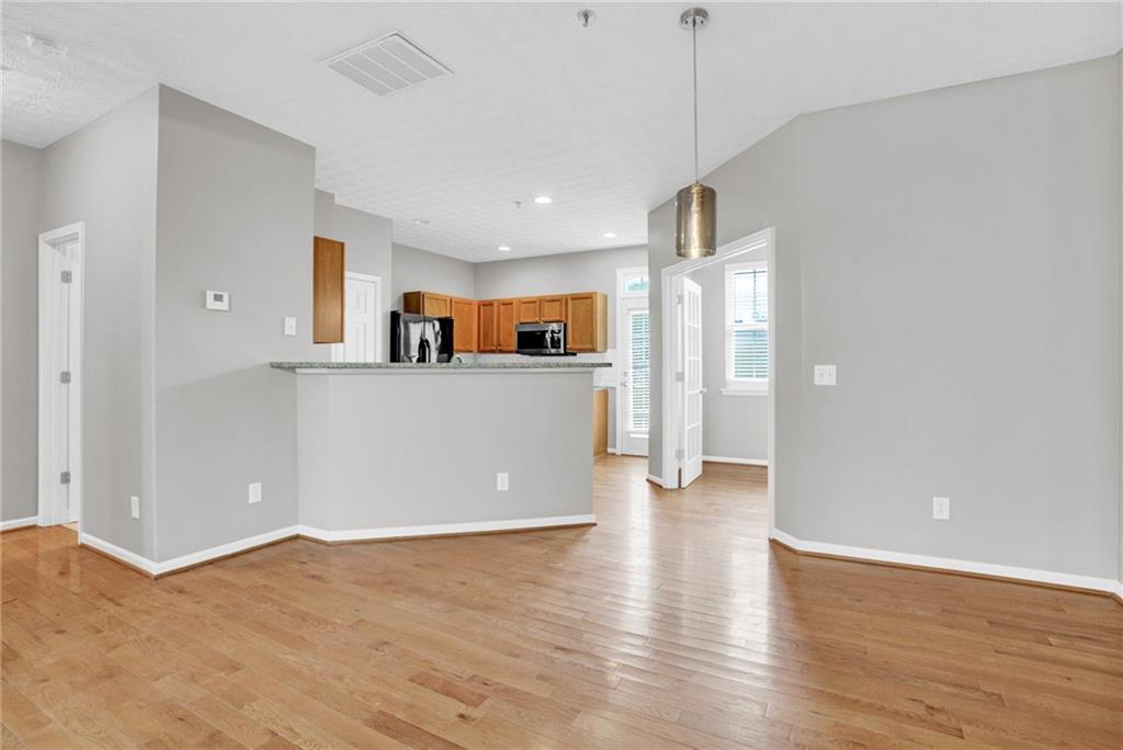 241 Village Square Drive Woodstock, GA 30188 - Photo 2 of 40 a view of a kitchen cabinets and a kitchen with wooden floor