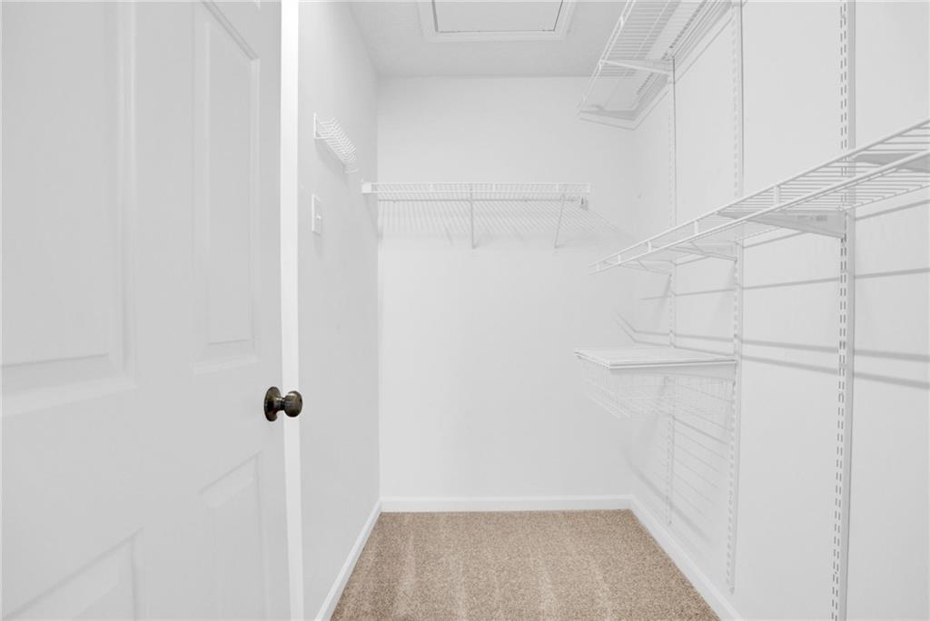 241 Village Square Drive Woodstock, GA 30188 - Photo 24 of 40 a view of a room with racks on the wall