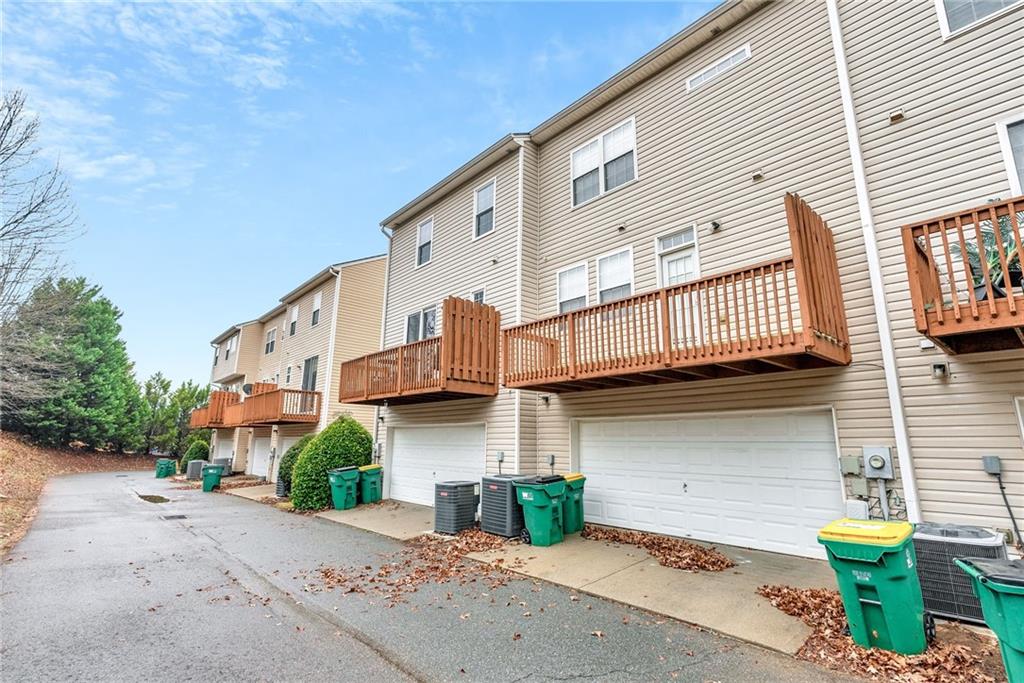 241 Village Square Drive Woodstock, GA 30188 - Photo 29 of 40 a view of a street with big house