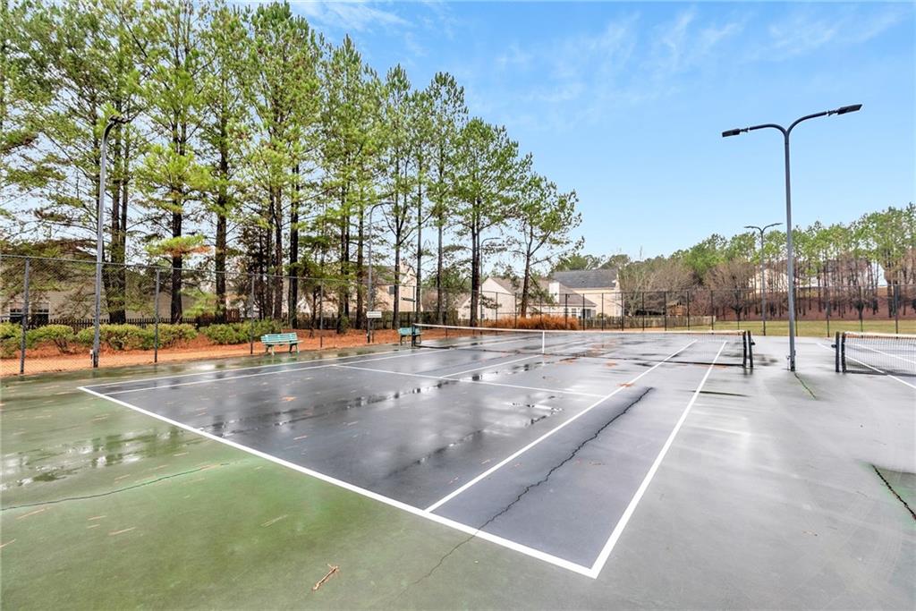 241 Village Square Drive Woodstock, GA 30188 - Photo 32 of 40 a view of a swimming pool with a patio