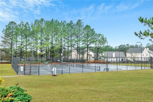a view of outdoor space with deck and tree in the background