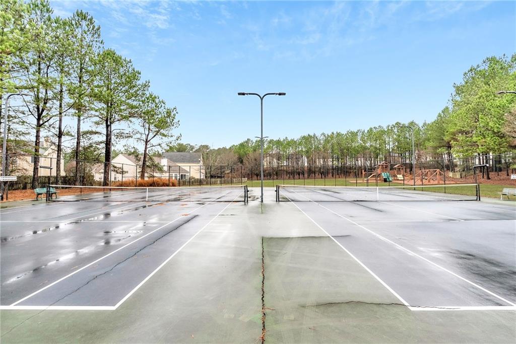 241 Village Square Drive Woodstock, GA 30188 - Photo 34 of 40 a view of a yard in front of a building