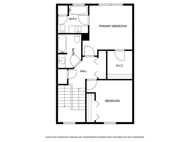 a picture of a bench in front of a wall