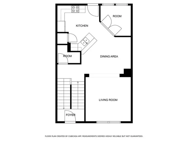 a picture of a bench in front of a wall