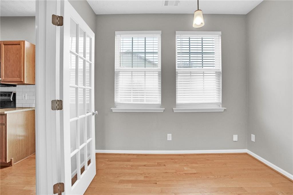 241 Village Square Drive Woodstock, GA 30188 - Photo 4 of 40 a view of an empty room with a window