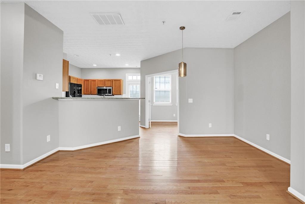 241 Village Square Drive Woodstock, GA 30188 - Photo 9 of 40 a view of a kitchen with wooden floor and a window